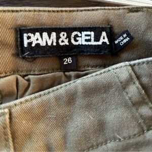 Pam & Gela woman’s olive green, colorful striped utility pants. Lace up back.